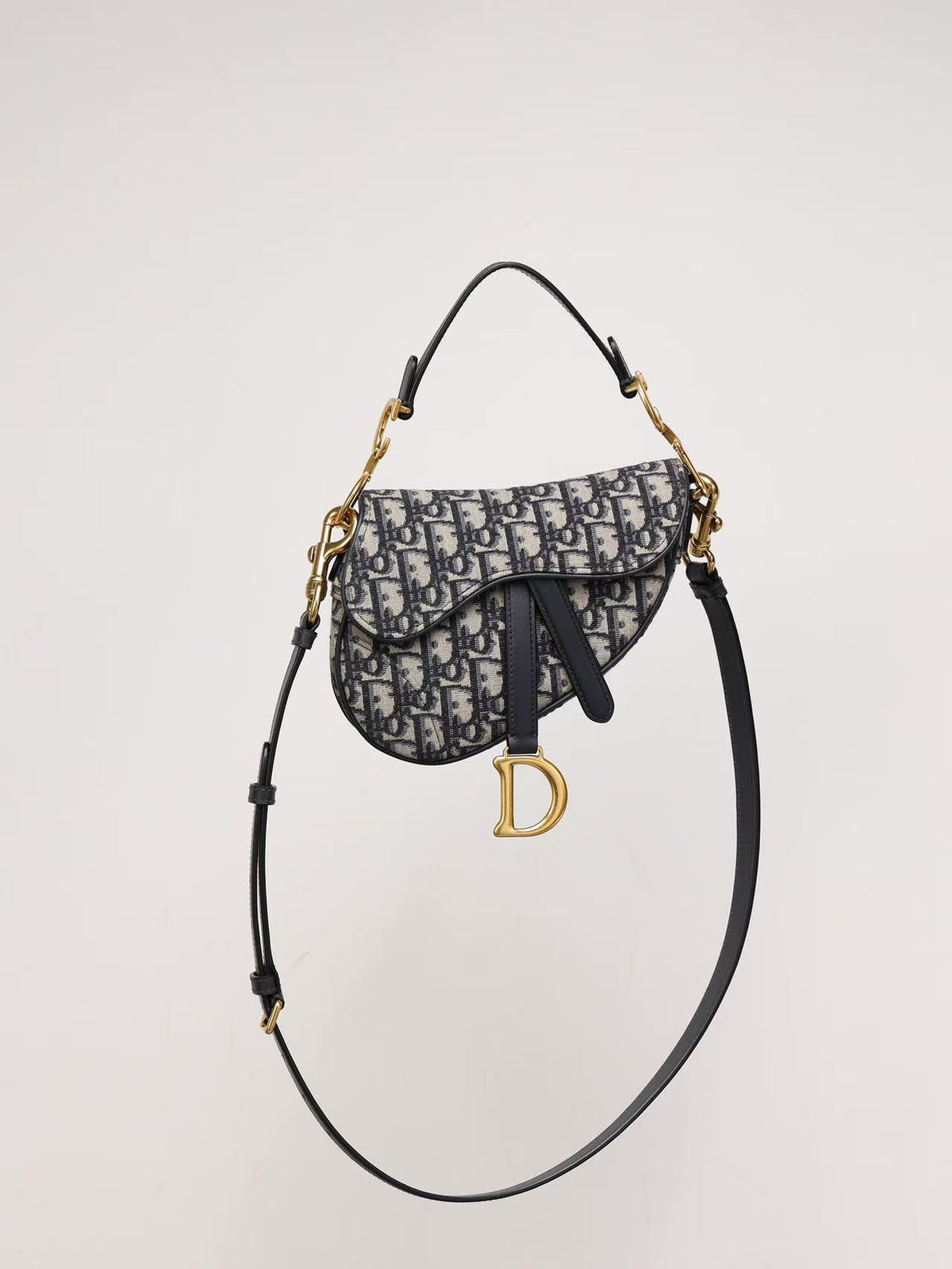Premium Beige & Black Patterned Saddle Bag with Gold-Tone Details