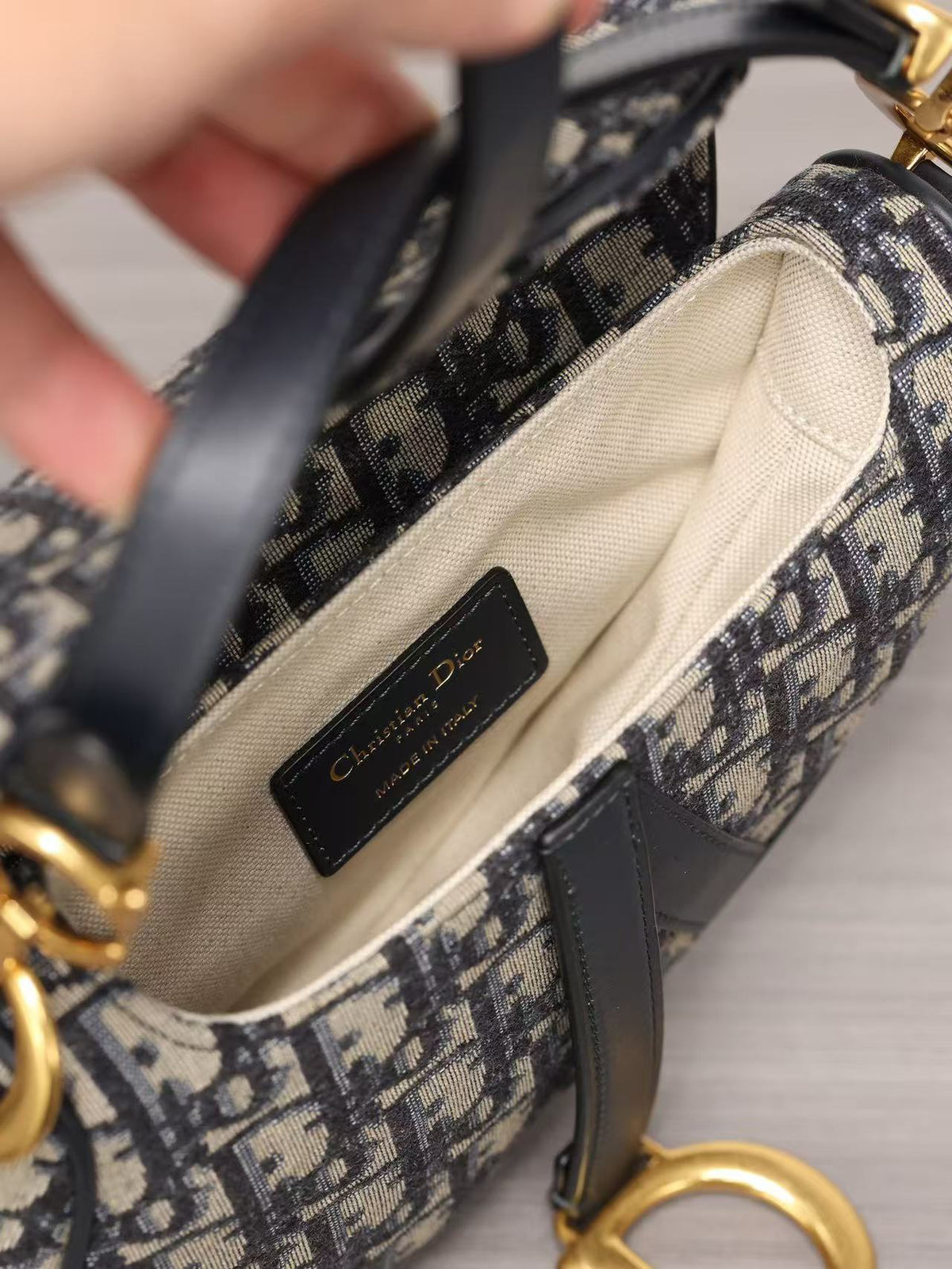 Premium Beige & Black Patterned Saddle Bag with Gold-Tone Details